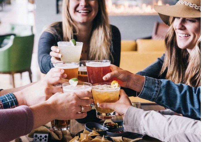 Origin Hotel Red Rocks — guests toasting in the lounge